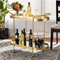 Kamal Glam Brushed Metal And Mirrored Glass 2 Tier Mobile Wine Bar Cart Gold - Baxton Studio 19 Kamal Glam Brushed Metal And Mirrored Glass 2 Tier Mobile Wine Bar Cart Gold - Baxton Studio -Baxton Studio Sale Shop GUEST 034e04a5 db63 474b 9d05 6c159816da1c