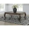 Signature Design By Ashley Maylee Coffee Table With Dark Brown Finish And Cabriole Legs